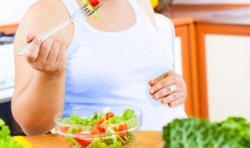 A woman eating salad