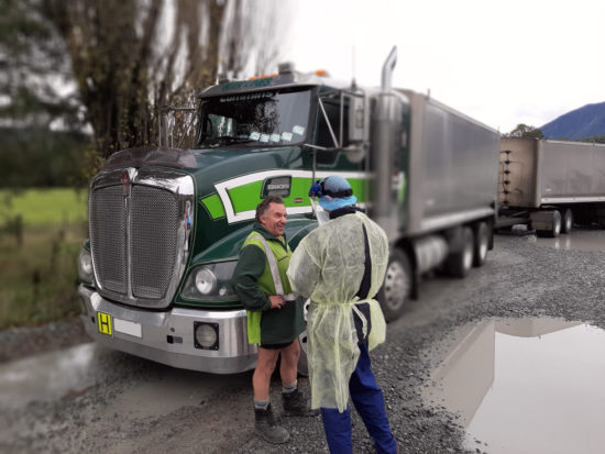 Registered nurse assessing health of truck driver at Springs Junction