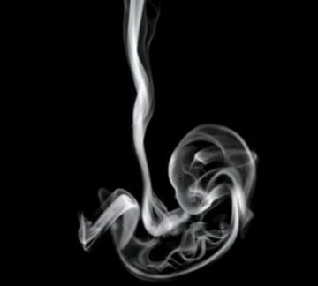 A visual impression of a strand of smoke in shape of a baby.